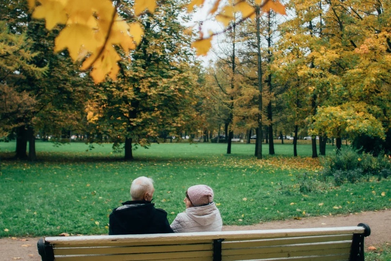 Vadim Viktorovich and his wife are sitting on a bench in the park